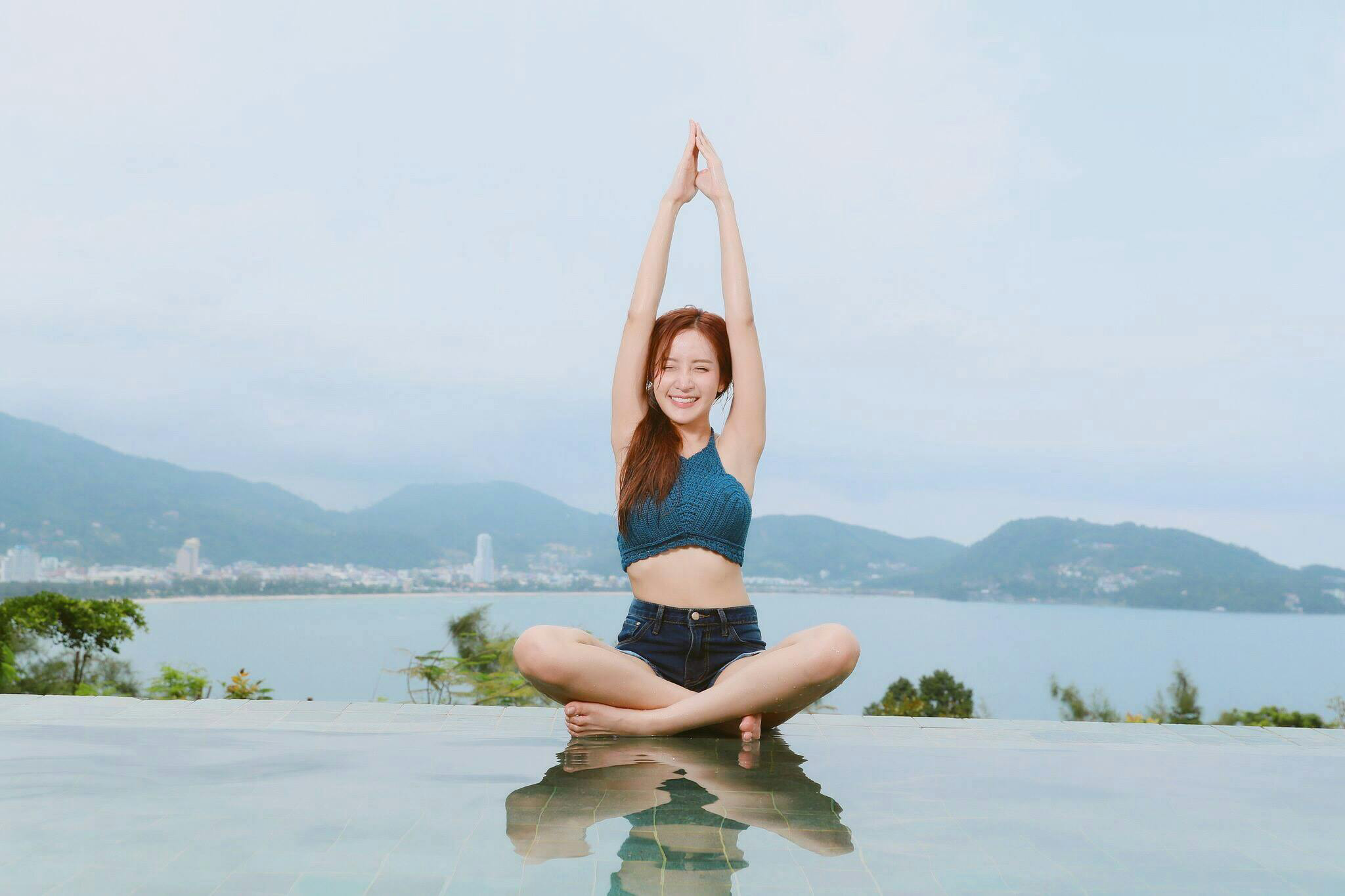 Sunset with woman doing yoga pose.